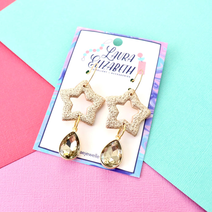 Gold starburst hoop earrings