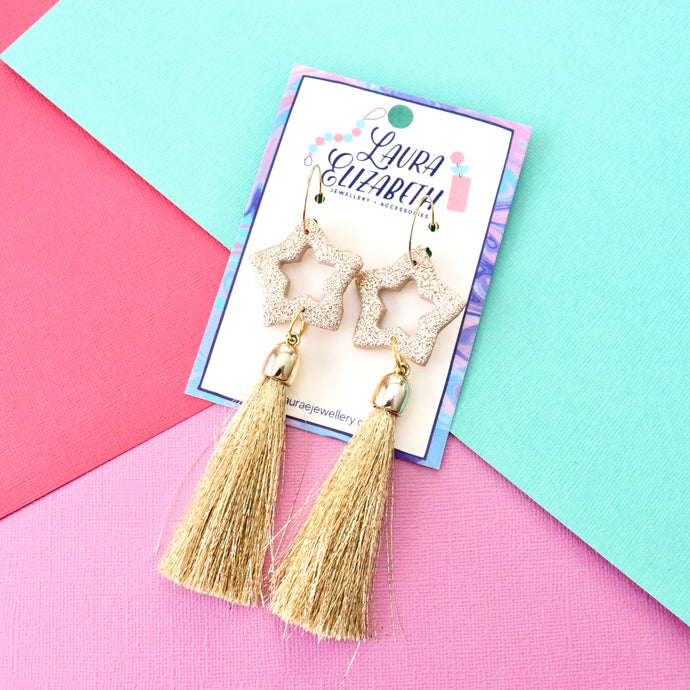 Gold starburst tassel hoop earrings